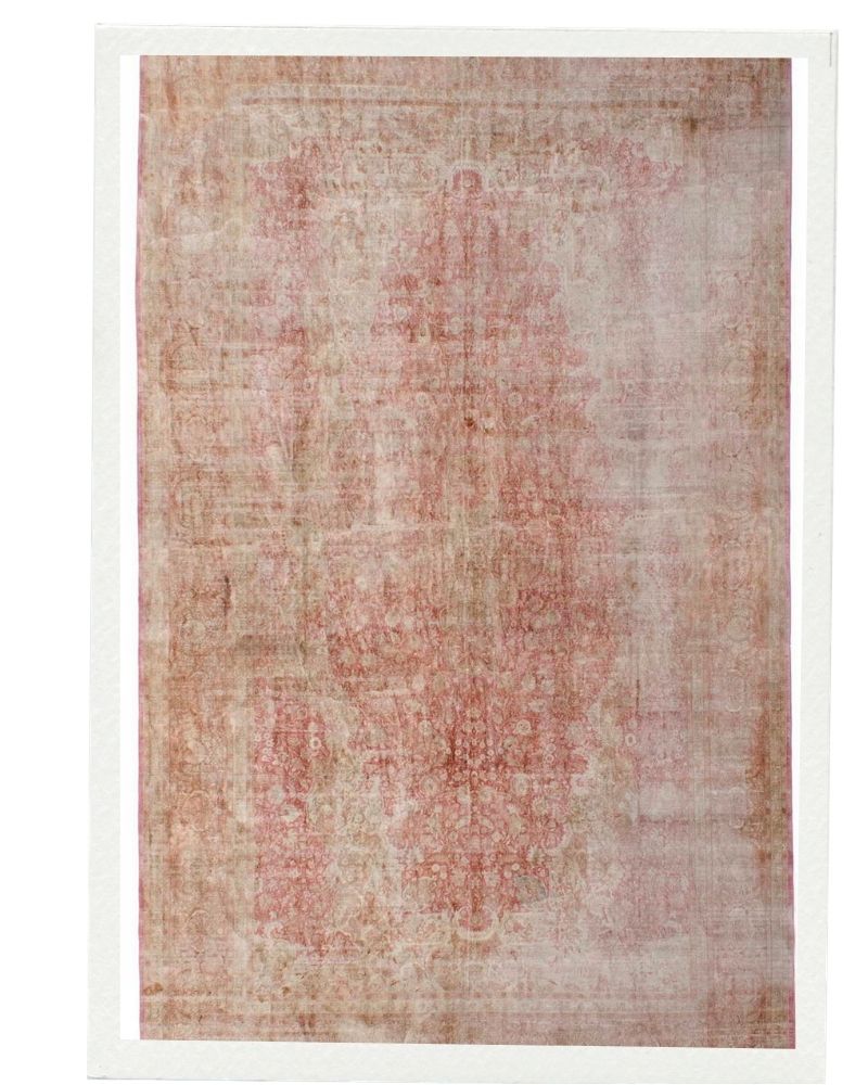 Lightly overdyed antique rug with pale rose tones and worn pattern, offering a soft and elegant interior accent